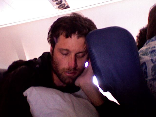 joeysleep_photo32 Joey Snoozin on the planeride home. We caught some Zs off and on during the 9 hour flight home.